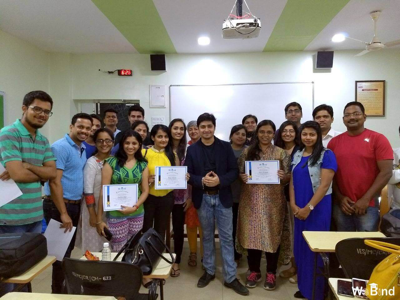 Nitin Raghani with workshop participants holding their training certificates